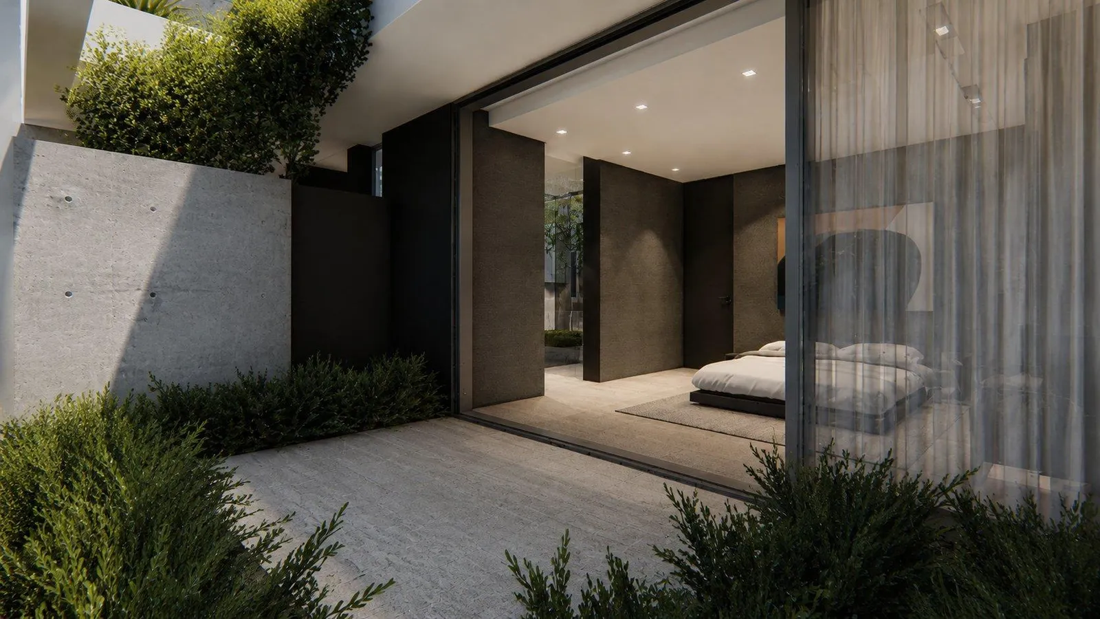 Bedroom opening to a planted terrace