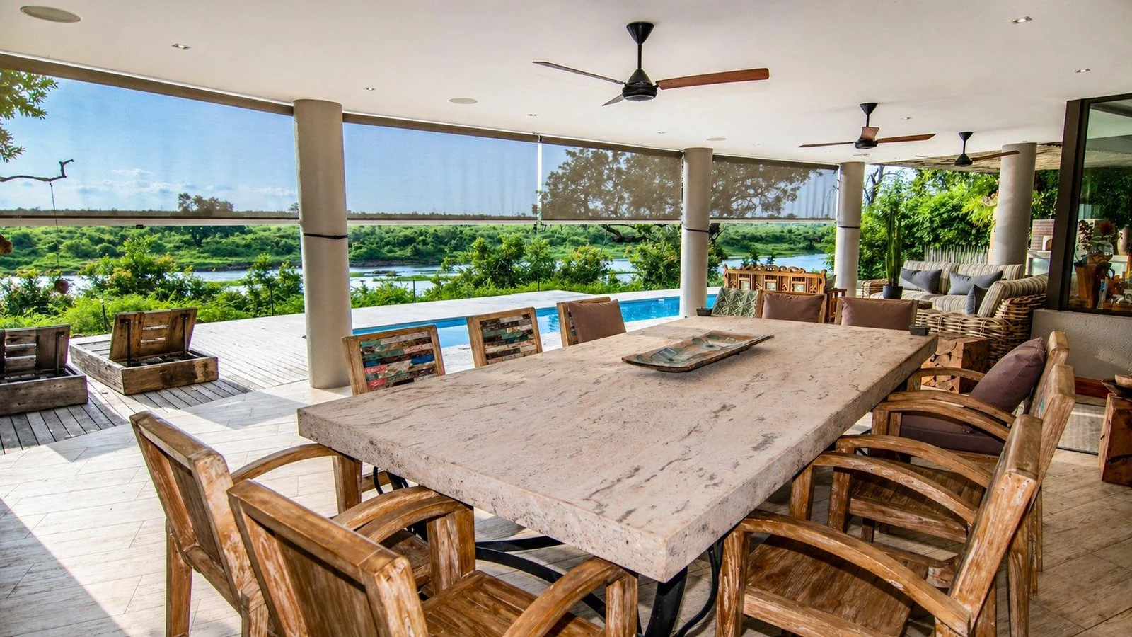 Outdoor dining table on the covered patio overlooking the river